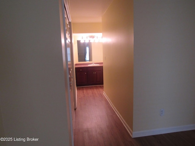 11802 Running Creek Rd, Douglass Hills, KY 40243 - hall with a sink, wood finished floors, and baseboards