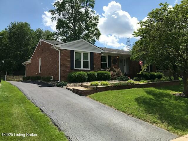 11802 Running Creek Rd, Douglass Hills, KY 40243 - ranch-style home featuring brick siding, a front yard, and driveway