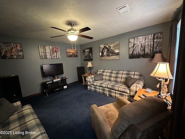 living room with ceiling fan, carpet floors, a textured ceiling, baseboards, and visible vents