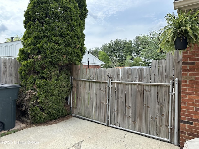 view of gate featuring fence