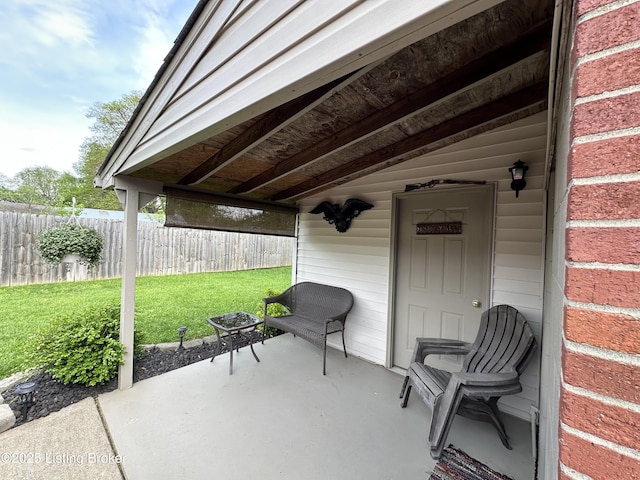view of patio / terrace featuring fence
