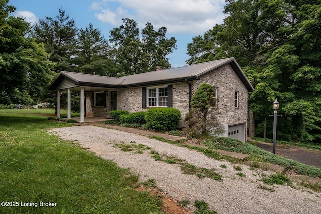 4217 Deckard School Rd, Radcliff, KY 40160 - ranch-style home with covered porch, gravel driveway, metal roof, and a garage