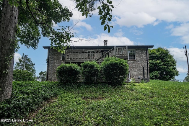 4217 Deckard School Rd, Radcliff, KY 40160 - rear view of house featuring brick siding, a chimney, stairs, and a deck
