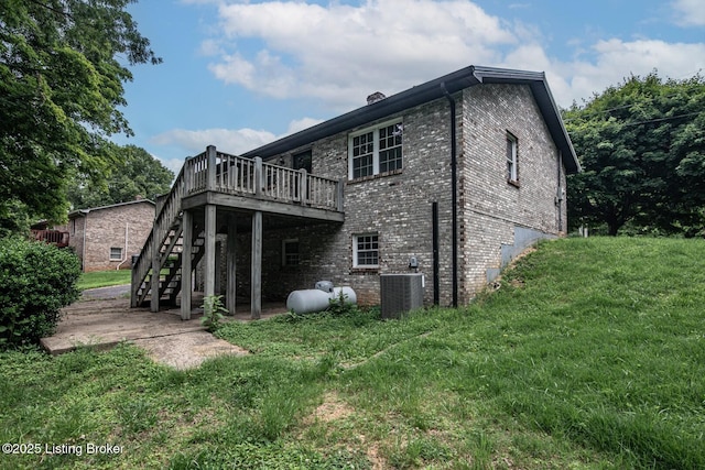 4217 Deckard School Rd, Radcliff, KY 40160 - back of property featuring central AC unit, a wooden deck, stairs, brick siding, and a lawn