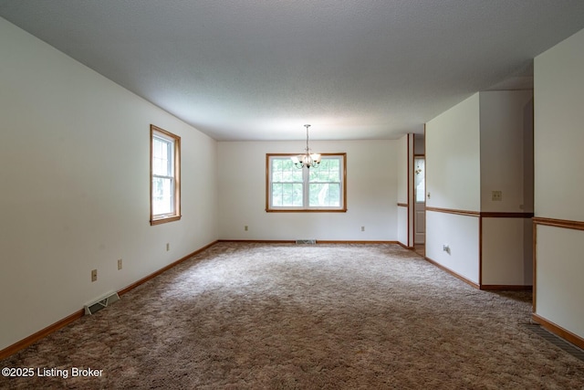 4217 Deckard School Rd, Radcliff, KY 40160 - spare room featuring a chandelier, carpet floors, and baseboards
