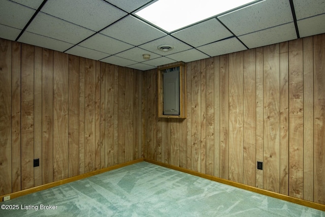 4217 Deckard School Rd, Radcliff, KY 40160 - unfurnished room featuring a paneled ceiling, carpet flooring, wooden walls, and baseboards