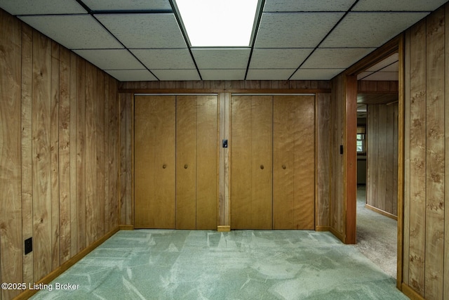 4217 Deckard School Rd, Radcliff, KY 40160 - basement with carpet floors, wood walls, baseboards, and a drop ceiling