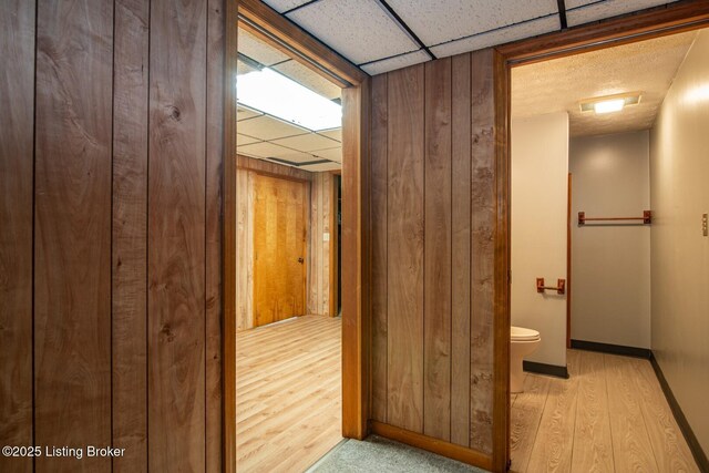 4217 Deckard School Rd, Radcliff, KY 40160 - hall with wood finished floors, wooden walls, baseboards, and a drop ceiling