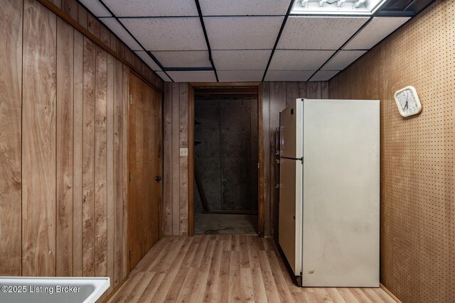4217 Deckard School Rd, Radcliff, KY 40160 - corridor with light wood-type flooring, wood walls, and a paneled ceiling