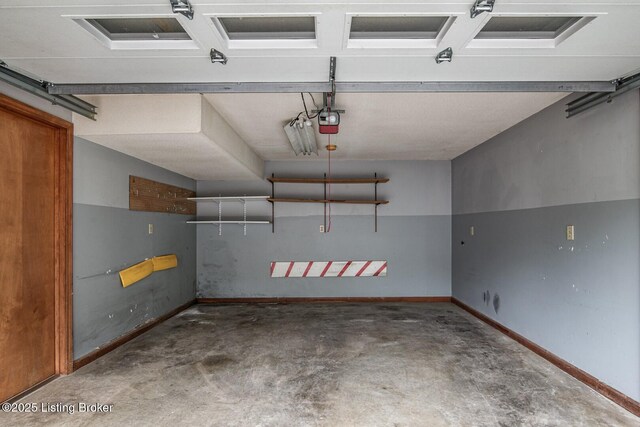 4217 Deckard School Rd, Radcliff, KY 40160 - garage featuring a garage door opener and baseboards
