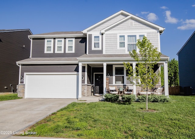 view of front of property with covered porch, a front lawn, concrete driveway, and an attached garage