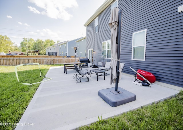 view of patio / terrace featuring fence