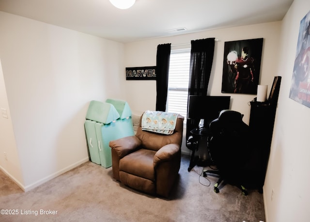 living area featuring visible vents, carpet floors, and baseboards
