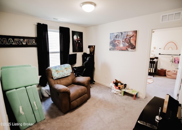 living area featuring visible vents and carpet floors
