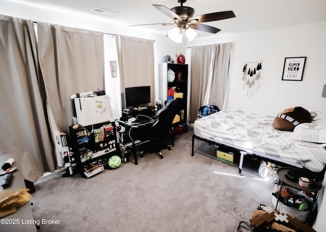 bedroom featuring visible vents, a ceiling fan, and carpet floors