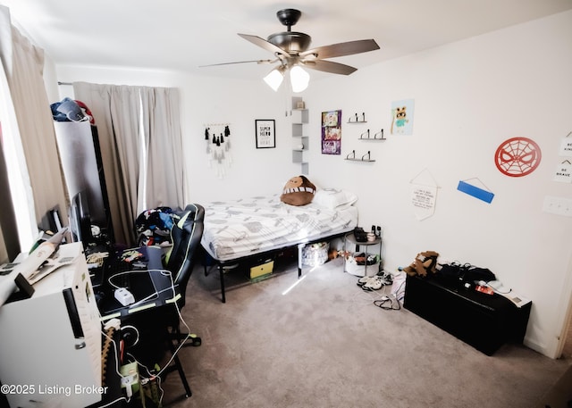 bedroom with a ceiling fan and carpet flooring