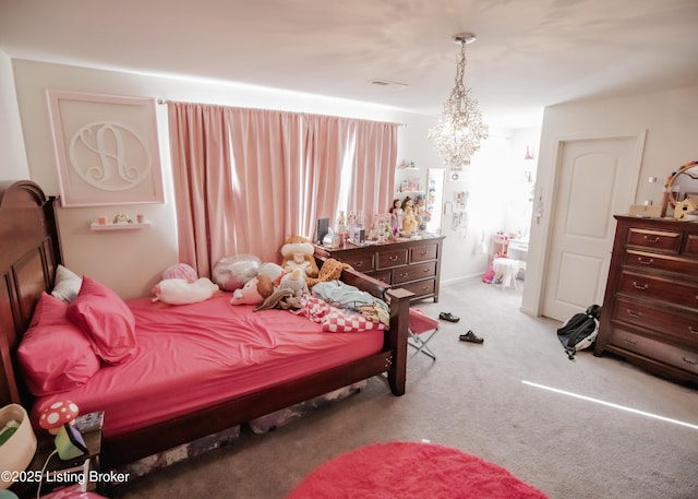 bedroom featuring an inviting chandelier, visible vents, and carpet floors