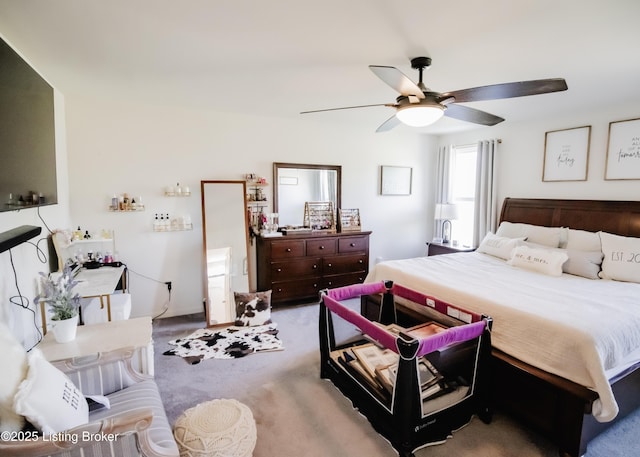 carpeted bedroom with a ceiling fan