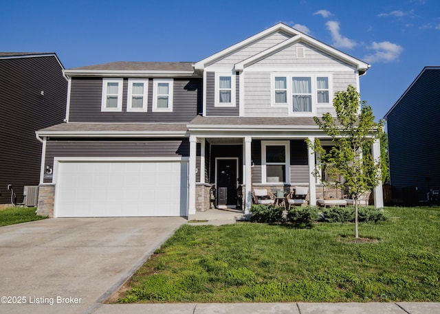 craftsman inspired home with concrete driveway, covered porch, a front yard, central AC, and a garage