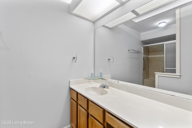 bathroom featuring vanity and a stall shower
