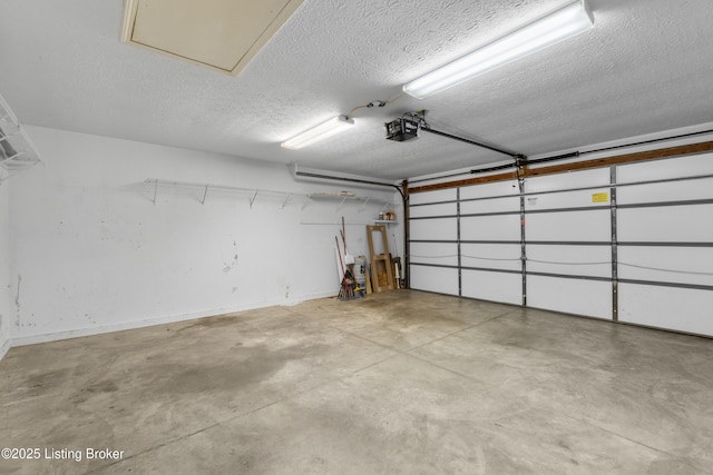 garage with baseboards and a garage door opener