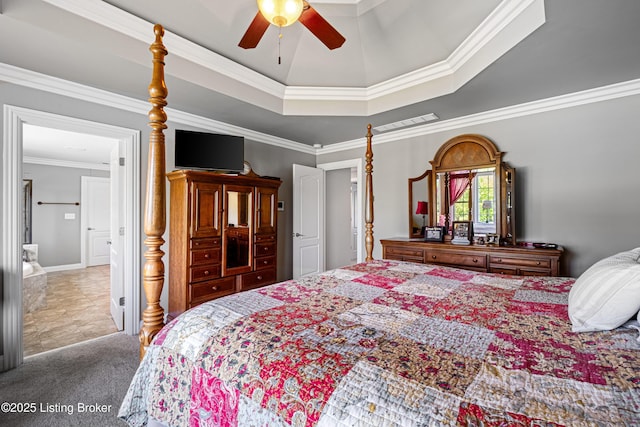 carpeted bedroom featuring crown molding, baseboards, a ceiling fan, and a tray ceiling