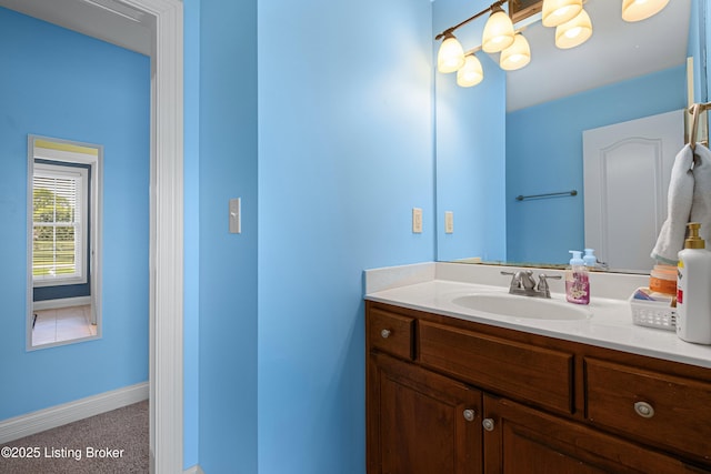 bathroom featuring vanity and baseboards