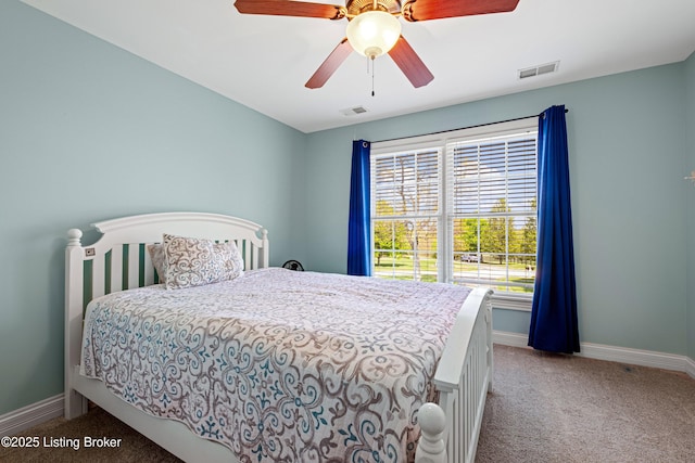 bedroom featuring baseboards, carpet, and visible vents