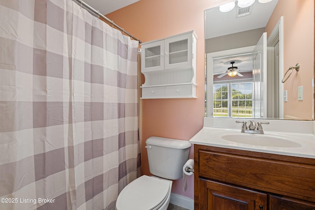 full bath featuring vanity, curtained shower, visible vents, and toilet
