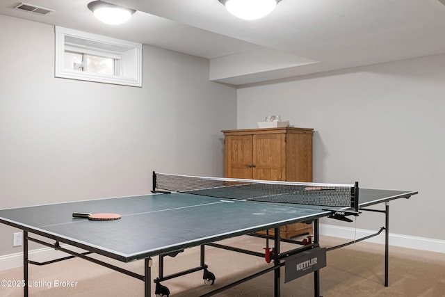 game room featuring baseboards, light carpet, and visible vents