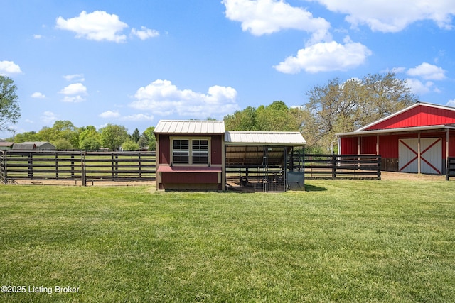 view of yard with an exterior structure and an outbuilding
