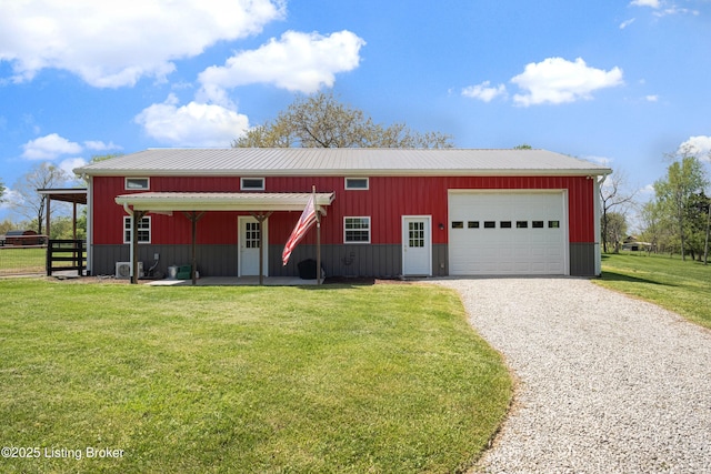 view of front of house featuring fence, driveway, metal roof, and a front lawn