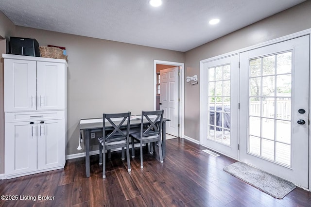 dining space featuring dark wood-style flooring, recessed lighting, and baseboards