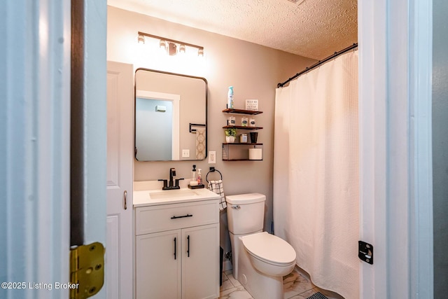 full bath with a textured ceiling, toilet, vanity, marble look tile flooring, and curtained shower