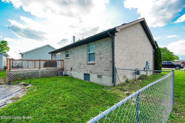 rear view of property featuring brick siding, a deck, central AC, and crawl space
