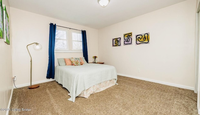 carpeted bedroom featuring baseboards