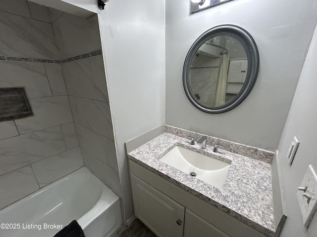 bathroom with vanity and tub / shower combination