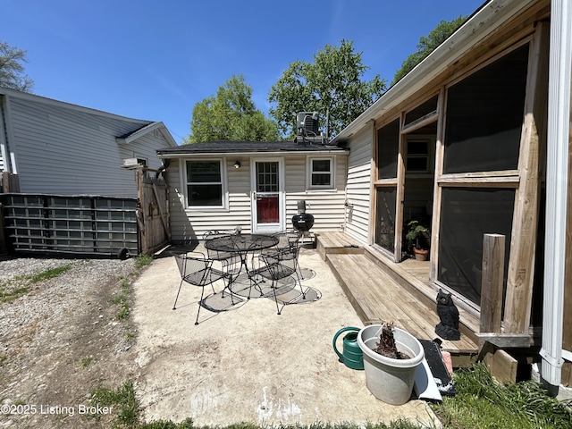 view of patio / terrace with a deck and outdoor dining space