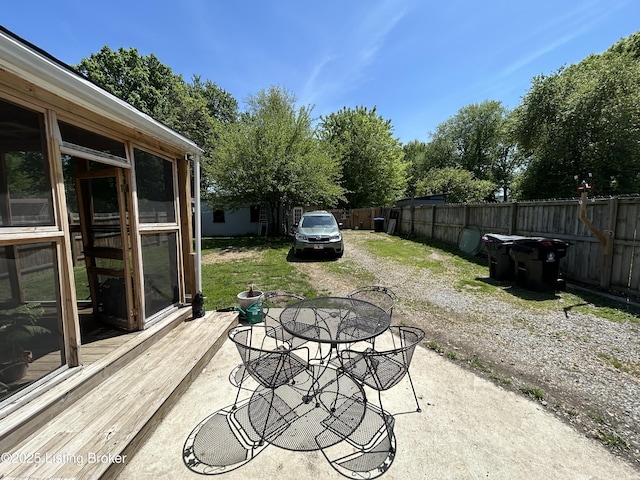 view of patio with fence and outdoor dining space
