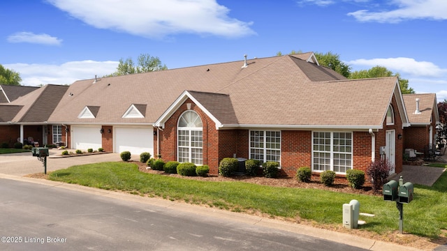 10436 Monticello Forest Cir, Louisville, KY 40299 - view of front of property featuring an attached garage, driveway, a front lawn, and brick siding