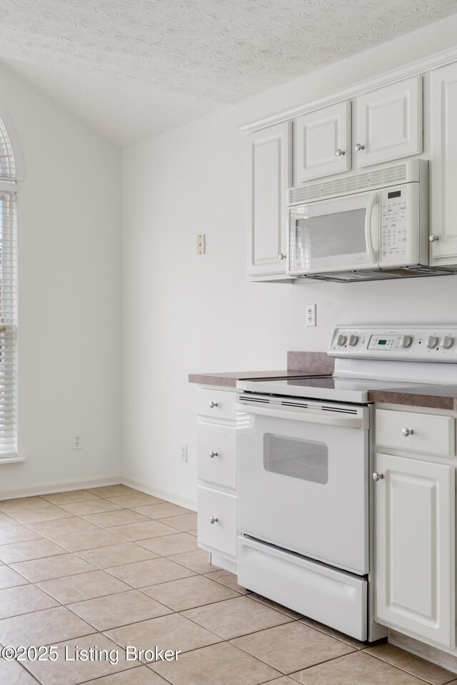 10436 Monticello Forest Cir, Louisville, KY 40299 - kitchen featuring white cabinets, white appliances, a textured ceiling, baseboards, and light tile patterned floors
