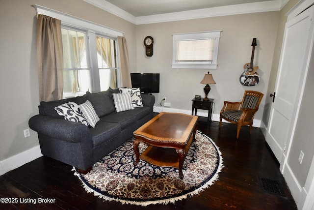 living room with dark wood-style flooring, visible vents, ornamental molding, and a healthy amount of sunlight