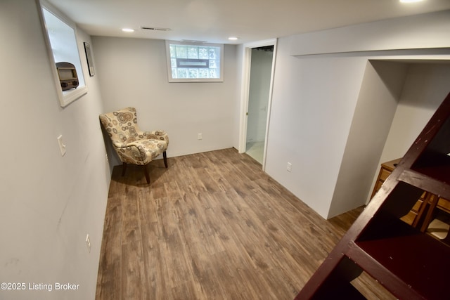 sitting room with recessed lighting, wood finished floors, and visible vents