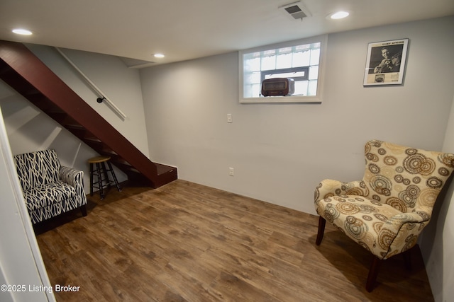 sitting room featuring stairs, recessed lighting, visible vents, and wood finished floors