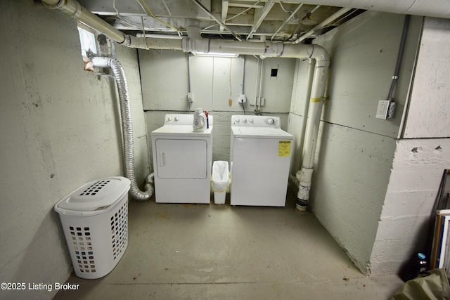 washroom featuring laundry area and washing machine and clothes dryer