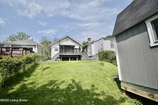 view of yard with stairway and a wooden deck