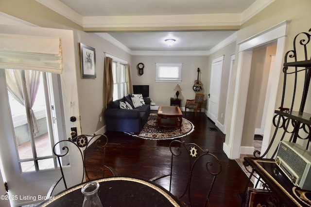 foyer with baseboards, ornamental molding, and wood finished floors