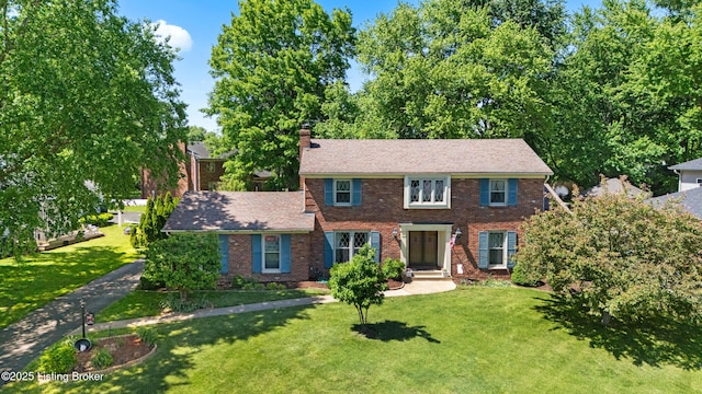7103 Green Spring Dr, Louisville, KY 40241 - colonial house with brick siding, a chimney, and a front yard