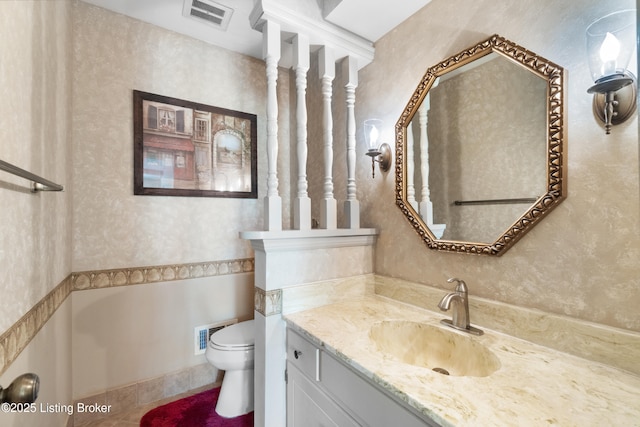 7103 Green Spring Dr, Louisville, KY 40241 - bathroom with toilet, vanity, tile patterned flooring, and wallpapered walls