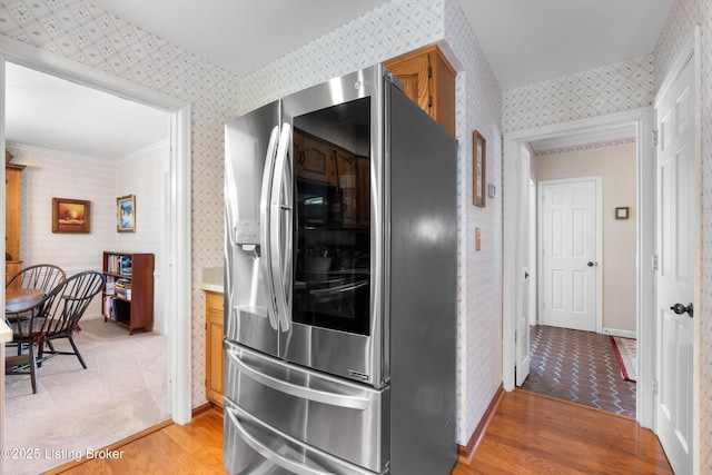 7103 Green Spring Dr, Louisville, KY 40241 - kitchen featuring stainless steel refrigerator with ice dispenser, wallpapered walls, light wood-style floors, baseboards, and light countertops